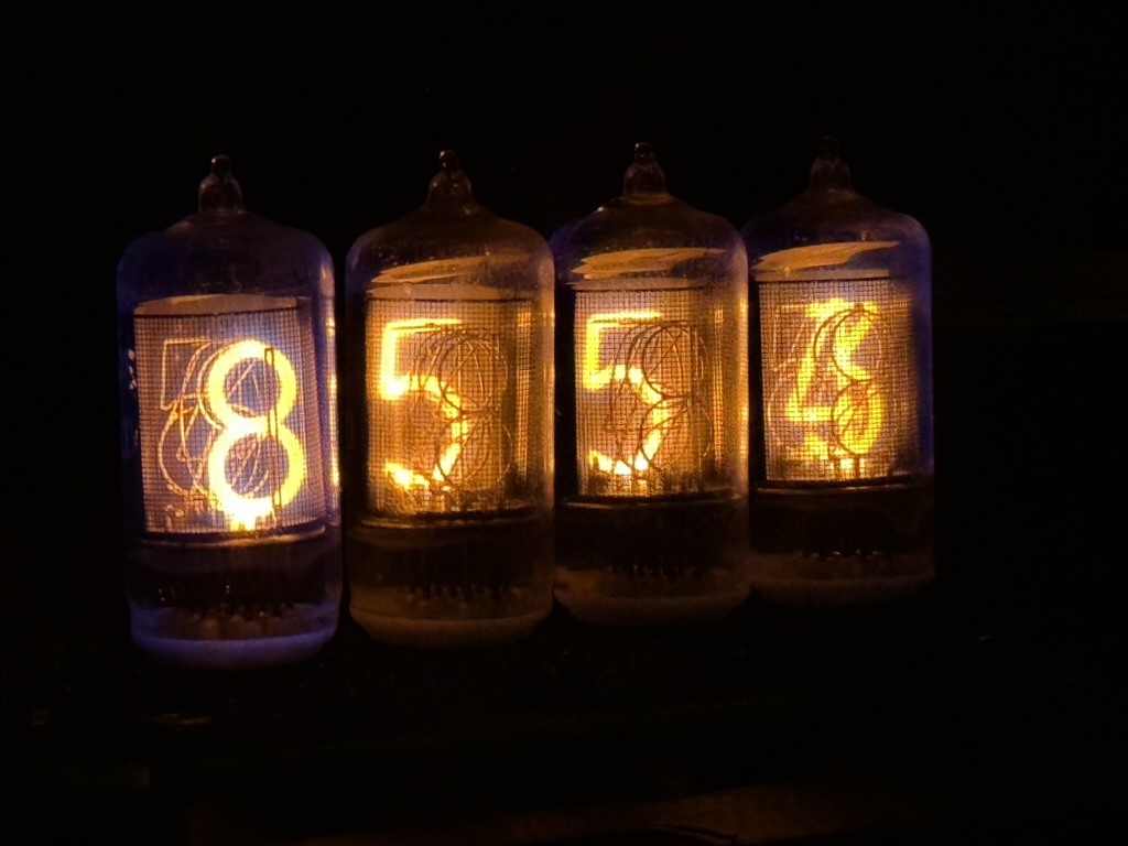 Four ZM1000 Nixie tubes with the numerals 8554 lit